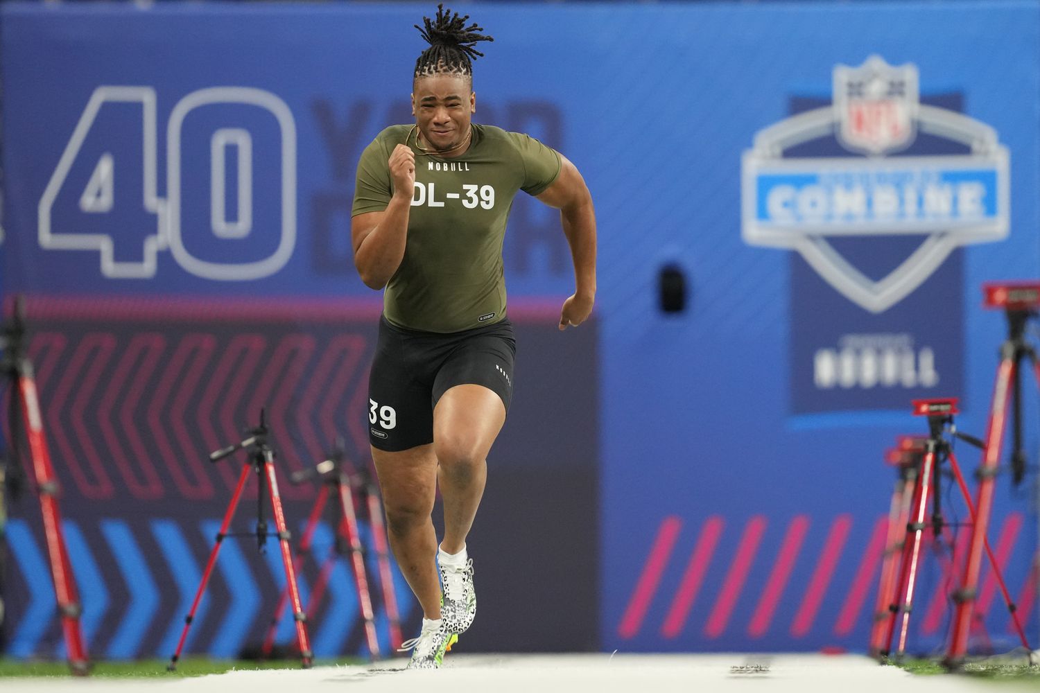 Mar 2, 2023; Indianapolis, IN, USA; Missouri defensive lineman Isaiah Mcguire (DL39) participates in drills during the NFL combine at Lucas Oil Stadium. Mandatory Credit: Kirby Lee-USA TODAY Sports
